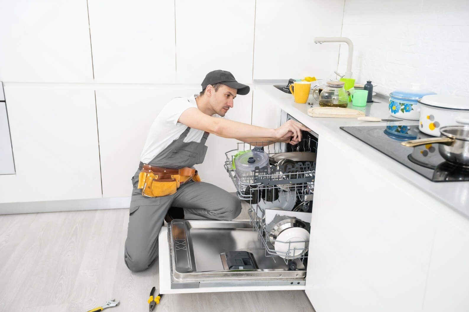 depositphotos_451396664-stock-photo-repair-of-dishwashers-the-master-transformed (1)